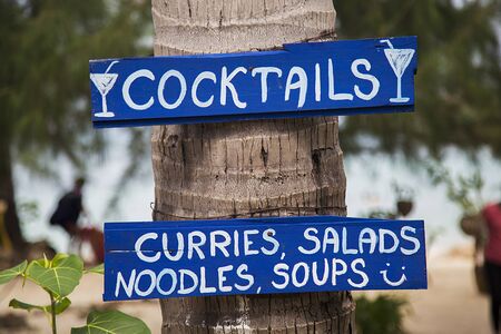 Signs for drinks and food in Ko Pha Ngan in Thailandの写真素材
