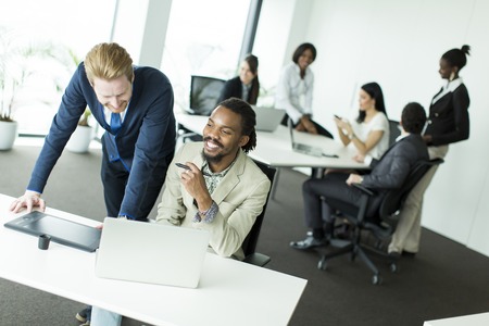 Businessmen working together at the desk in the office
