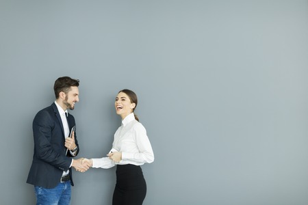 Business people shaking hands in the officeの写真素材