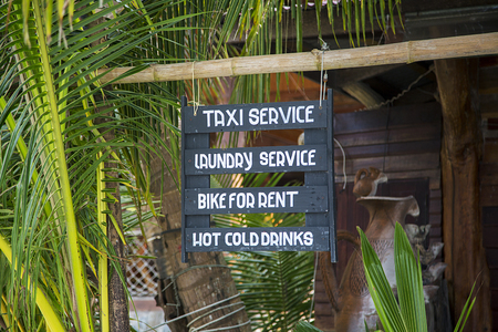 Service posts on a hanging wooden planksの写真素材