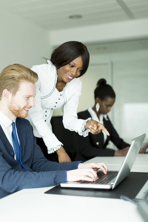 Young business couple working together in the officeの写真素材