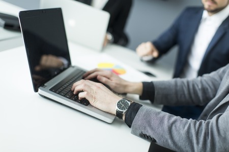 Businessman working on the laptop in the officeの写真素材