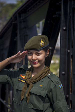 KANCHANABURI, THAILAND - JANUARY 29, 2016: Thai woman in uniform at the bridge on the river Kwai....