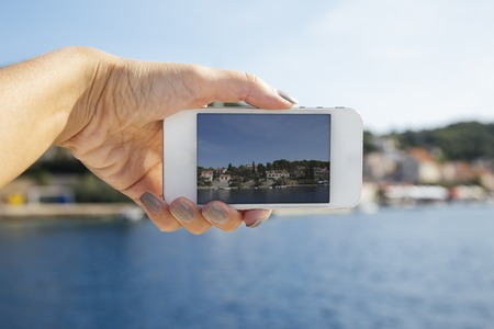 Photographing with smartphone at Solta, Adriatic sea, Croatiaの写真素材