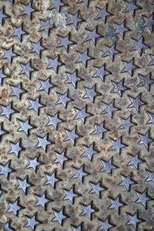 Texture of the metal manhole cover of street sewage shaft