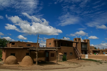 TAOS PUEBLO, USA - JULY 27, 2008: Unidentified tourists at San Geronimo Chapel in Taos Pueblo, New Mexico. Church was first built around 1620 and was destroyed 4 times, new chapel was buit in 1850のeditorial素材