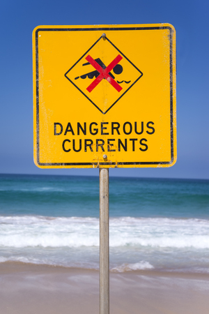 Dangerous currents sign on the beach in Australiaの写真素材