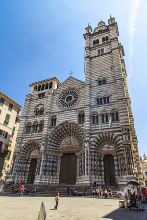 GENOA, ITALY - JUNE 2, 2015: Unidentified people by the Genoa Cathedral in Italy. Genoa Cathedral is a Roman Catholic cathedral dedicated to Saint Lawrence and is the seat of the Archbishop of Genoa.のeditorial素材