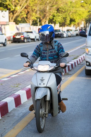 CHIANG MAI, THAILAND - JANUARY 31, 2016: Unidentified man on the street of Chiang Mai, Thailand. Chiang Mai is the largest and most culturally significant city in Northern Thailand.のeditorial素材