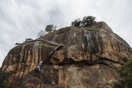 MATALE, SRI LANKA- JANUARY 28, 2014: Unidentified tourists at Sigiriya Rock Fortress at Matale. Sigiriya today is a UNESCO listed World Heritage Site and most visited historic site in Sri Lanka.のeditorial素材