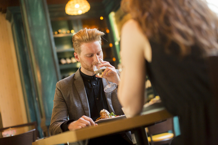 Young couple in the restaurant and have a romantic dinnerの写真素材