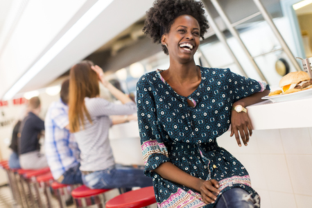 Young african american woman in the dinerの写真素材
