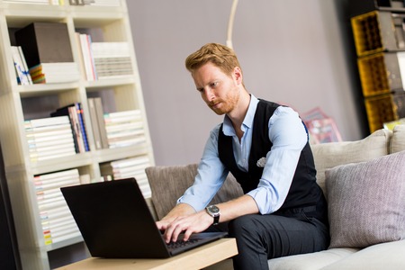 Young man working on laptop in he office