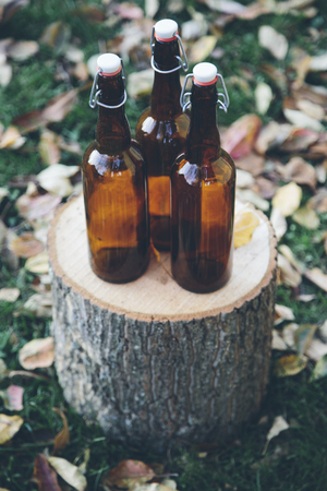 Glass bottles on wooden stackの写真素材