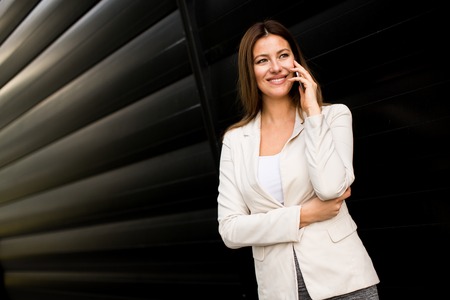 Businesswoman on the phone at outdoorの写真素材