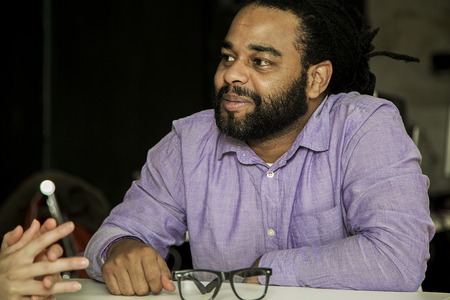 Face of the young man sitting at the deskの写真素材