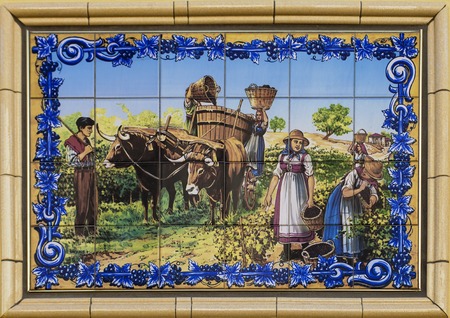 CRUZY, FRANCE - JULY 22, 2015: Artistic tiles depicting village scene. Cruzy is a wine village in Languedoc-Roussillon region. with hundreds of vineyards, domaines, chateaux and small producers making wines.のeditorial素材