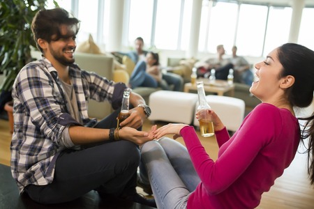 Young couple having fun at partyの写真素材