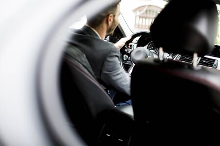 Young man driving in the  modern carの写真素材