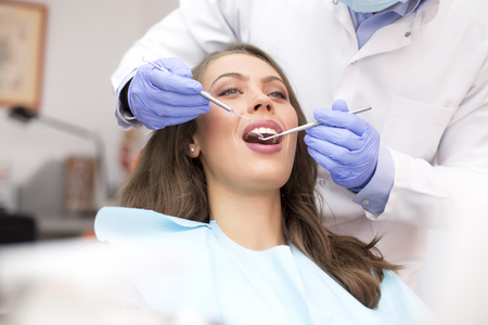 Young woman getting dental treatmentの写真素材