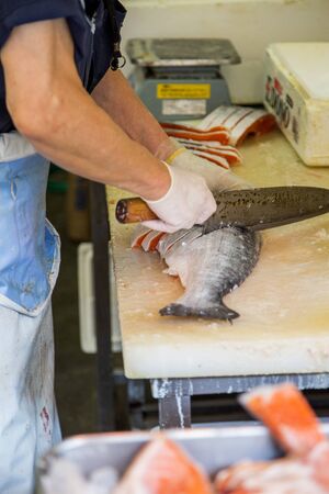 TOKYO, JAPAN - OCTOBER 2, 2016: Unidentified people at Tsukiji fish market in Tokyo, Japan. Tsukiji is the biggest wholesale fish and seafood market in the world.のeditorial素材