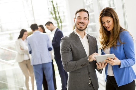 View at young business couple using tablet in the officeの写真素材