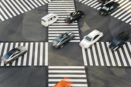 TOKYO, JAPAN- OCTOBER 12, 2016:  Unidentified people crossing the busy street in Ginza, Tokyo.It is a popular upscale shopping area of Tokyo.のeditorial素材