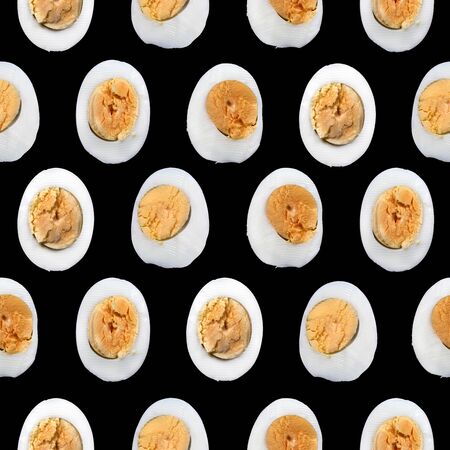 Seamless pattern of  boiled eggs cut in halfの写真素材