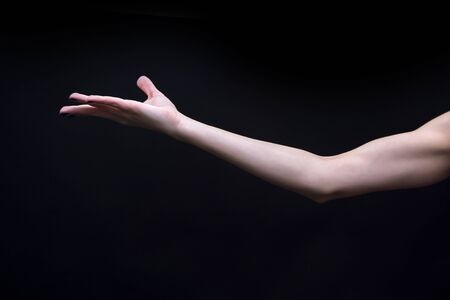 Female Yoga mudra hand isolated on black backgroundの写真素材