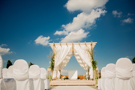 Beautiful wedding flower arrangement of seats along the aisleの写真素材