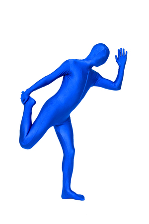 Mysterious blue man in morphsuit holding leg isolated on whiteの写真素材