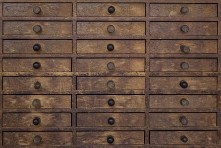 Closeup detail of the old vintage wooden drawersの写真素材
