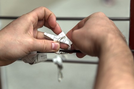 TOKYO, JAPAN - OCTOBER 3, 2016: Unindetified people put messages with the wishes at Asakusa temple in Tokyo, Japan. It is Tokyo oldest and one of most significant temples.のeditorial素材