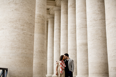 Loving couple at the St. Peter's Square in Vaticanの写真素材