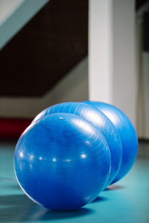 Group of blue pilates balls in the gymの写真素材