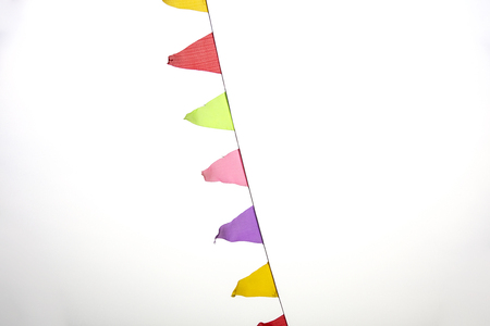 Multicolored flags against the sky