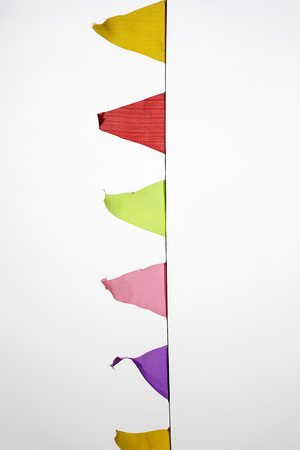 Multicolored flags against the sky