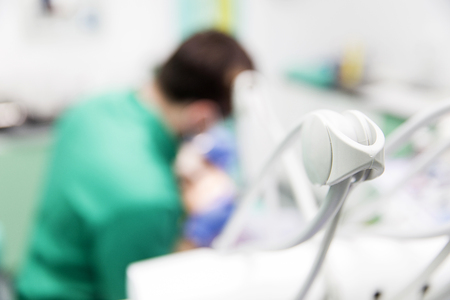 Young woman getting dental treatment in dentist officeの写真素材