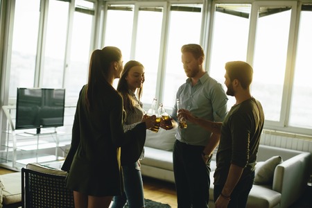 Group of male and female friends having fun at homeの写真素材