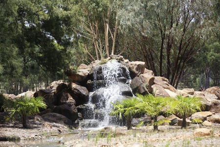 DUBBO, AUSTRALIA - JANUARY 4, 2017: Water cascade from Taronga Western Plains Zoo in Dubbo, Australia. This city zoo was opened at 1977 and now have more than 1000 animalsのeditorial素材