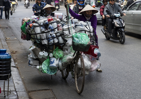 HANOI, VIETNAM - MARCH 2, 2017: Unidentified women taking goods to market in Hanoi, Vietnam. Hanoi is capital of Vietnam and have more than 7,5 million citizens.のeditorial素材