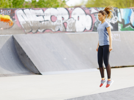 Pretty young woman having exercise outdoorsの写真素材