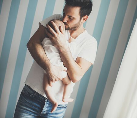 View at father and newborn baby