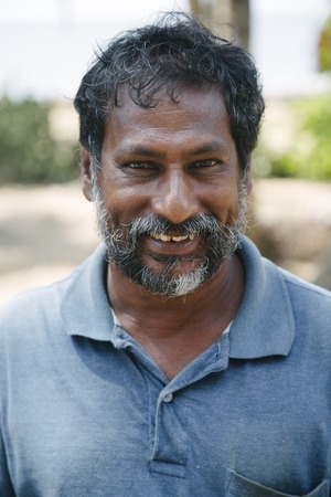 NEGOMBO, SRI LANKA - JANUARY 20, 2014: Unidentified man on the street of Negombo, Sri Lanka. Negombo is the fourth largest city in Sri Lanka.のeditorial素材