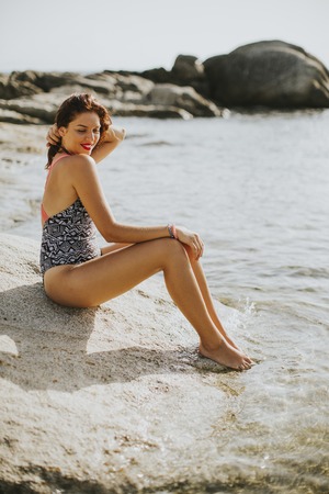 View at woman on the beach in summerの写真素材