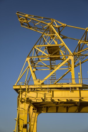 Closeup detail of the yellow dock crane