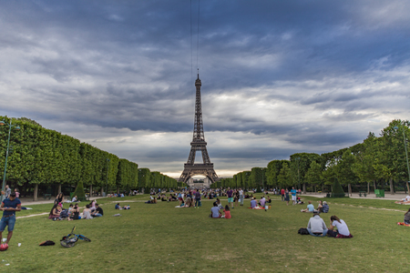 PARIS, FRANCE - JUNE 11, 2017: Unidentified people on the Champ de Mars in Paris, France. This large...