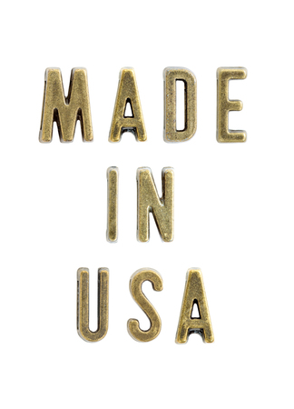 Vintage copper letters forming text made in USA isolated on the white backgroundの写真素材