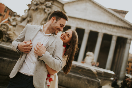 Happy loving couple, man and woman traveling on holidays in Rome, Italyの写真素材