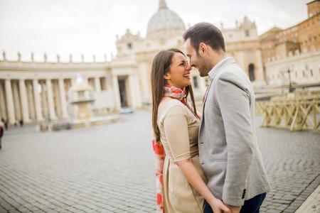 Loving couple at the St. Peter's Square in Vatican, Italyの写真素材